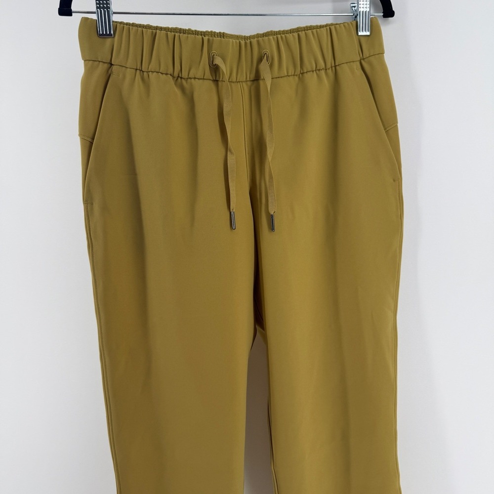 Lululemon On the Fly 7/8 Pant Mustard Gold Luxtreme Drawstring Womens 6